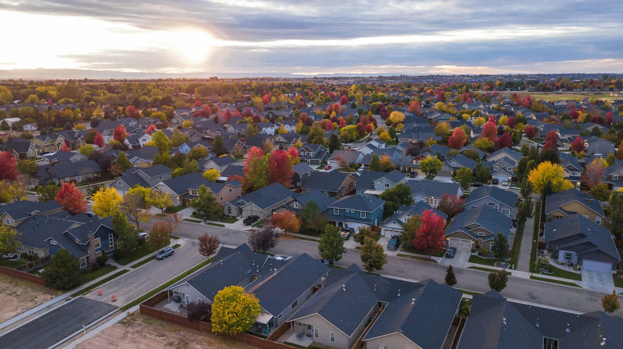 Aerial view of a neighborhood with colorful autumn trees